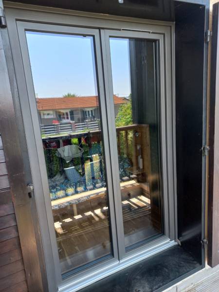 Porte fenêtre en alu posée par WINDOWS OUVERTURE
